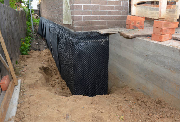 Happy homeowners after waterproofing job in Shiocton